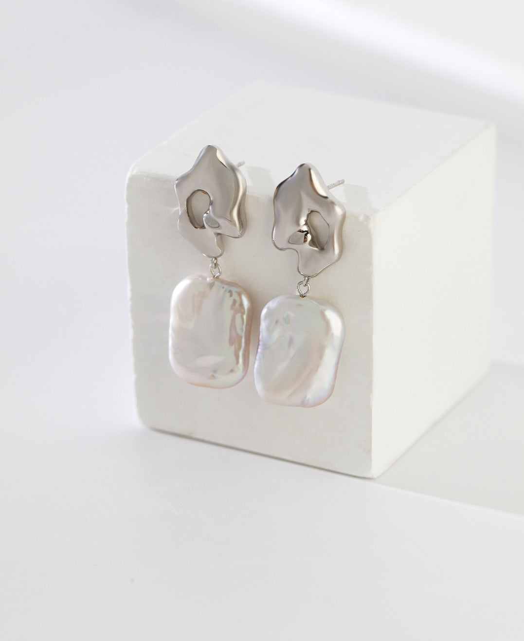 Elegant Sterling Silver Baroque Pearl Earrings: A Fusion of Artistry and Rarity